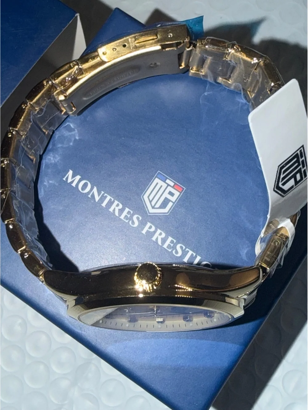 Montres Prestige gold-tone watch with moonphase dial